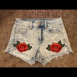 American Eagle jean shorts with rose patches